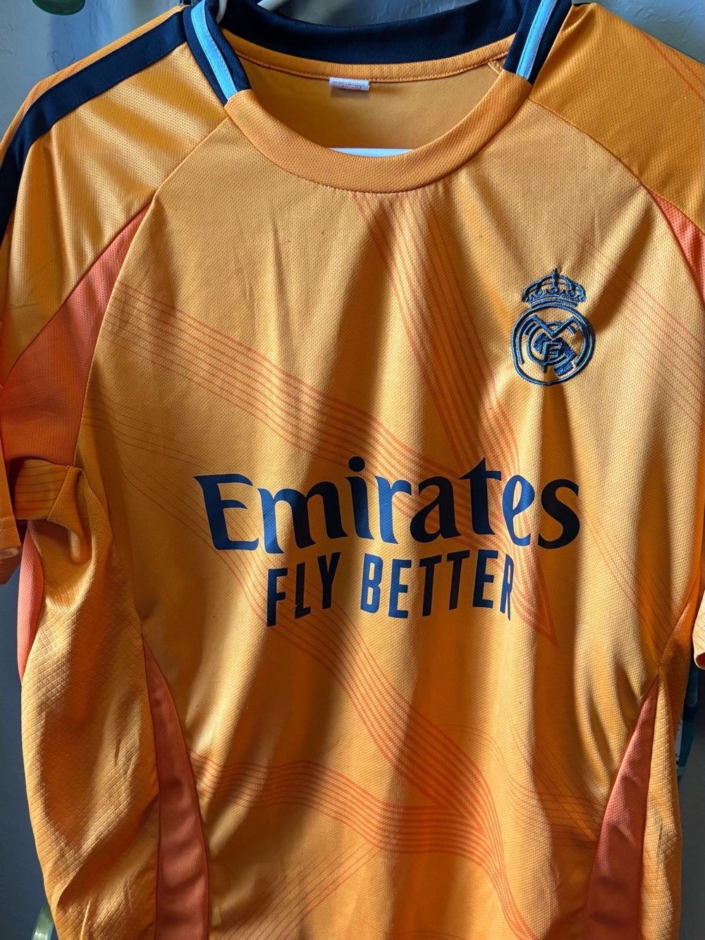 Real Madrid men’s large Orange Football Jersey with Crest and Sponsor Logo